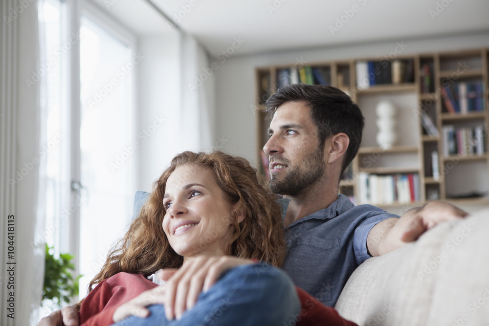 Relaxed couple at home on couch Relaxed couple at home on couch