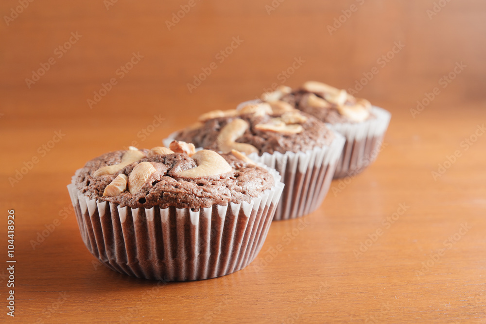 Cup of Brownies With Cashew nuts On Wooden Background Cup of Brownies With Cashew nuts On Wooden Background