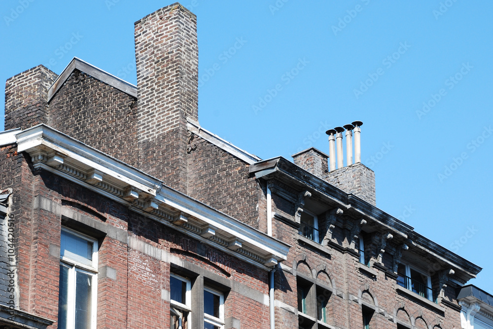 Eclectic old roofs and architectural details, such as windows, attics, balconies in the city of Liege, Belgium. Eclectic old roofs and architectural details, such as windows, attics, balconies in the city of Liege, Belgium.