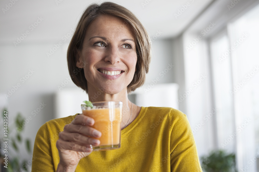 Smiling woman with a smoothie Smiling woman with a smoothie