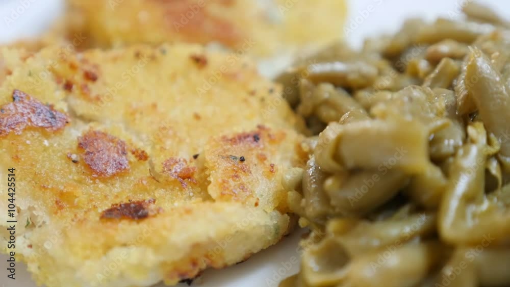 Fried fish and green beans tasty healthy lunch on plate 1920X1080 FullHD tilting footage - Slow tilt on food background of fried fish burgers and vegetables 1080p HD video Fried fish and green beans tasty healthy lunch on plate 1920X1080 FullHD tilting footage - Slow tilt on food background of fried fish burgers and vegetables 1080p HD video