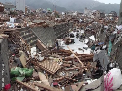 Search and rescue teams hunt for survivors following the devastating earthquake and tsunami in Japan in 2013 photo