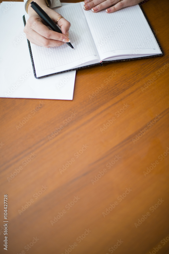 she writes pen on a pad she writes pen on a pad