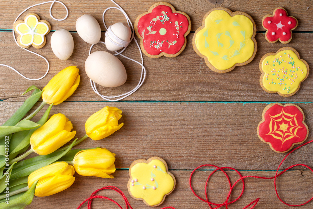 Homemade baked gingerbread, Easter eggs and tulips Homemade baked gingerbread, Easter eggs and tulips
