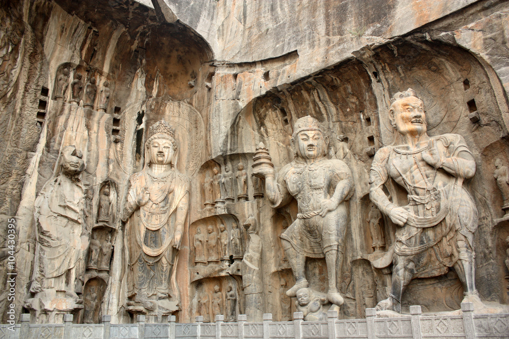 Figures in Longmen Caves. Longmen Grottoes with Buddha's figures are located at Yi River, Luoyang City, China