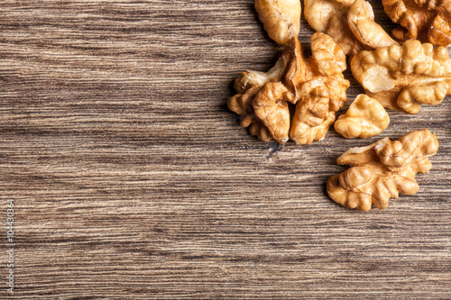 Raw organic nuts on wooden background