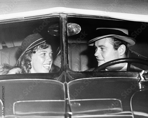 Happy couple in antique car 