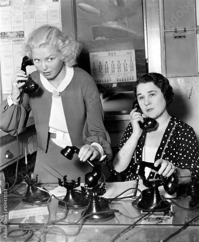 Two women working on a phone bank 