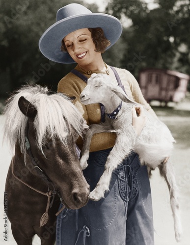 Woman with goat and pony 