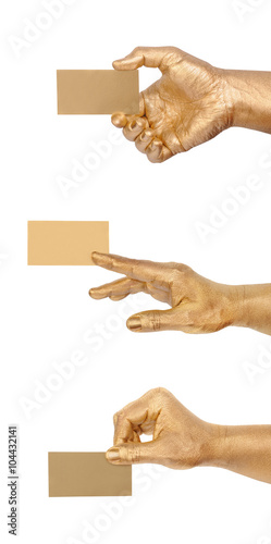 Man's golden hand holding an empty business card