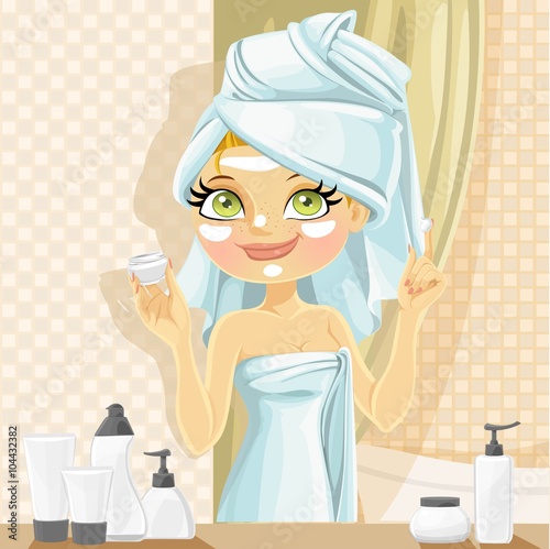 Cute girl in turban from towel put a cream on face from jar in t