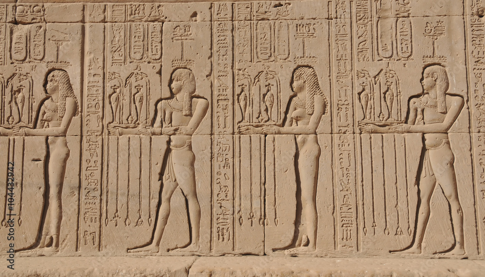 Parade of fertility offerings on the external walls of the Hathor Temple at Dendera