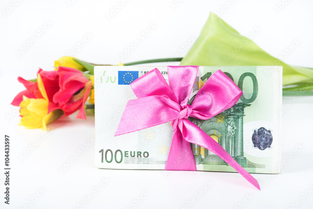 A pile of banknotes related ribbon on gift. A pile of banknotes related ribbon on gift.