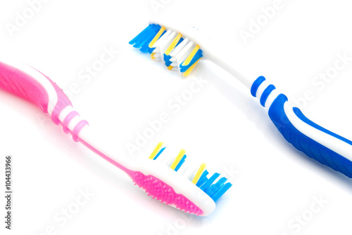 two toothbrushes on white