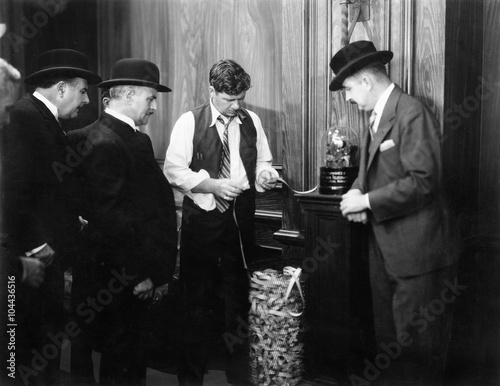 Fotografija Men reading the ticker machine