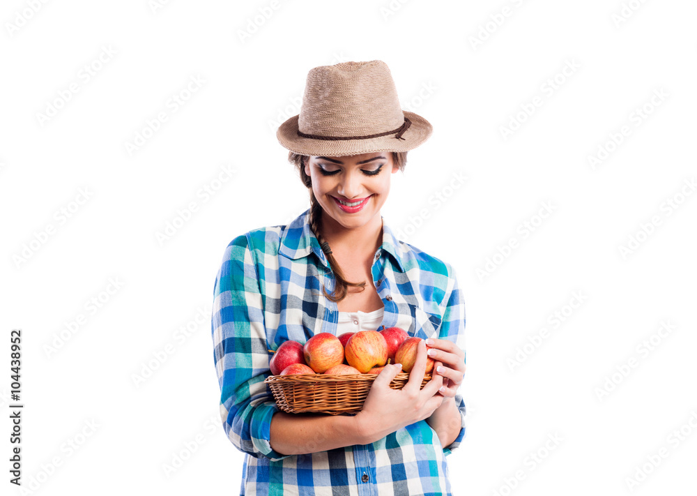 Woman, checked shirt holding basket with apples. Autumn harvest Woman, checked shirt holding basket with apples. Autumn harvest