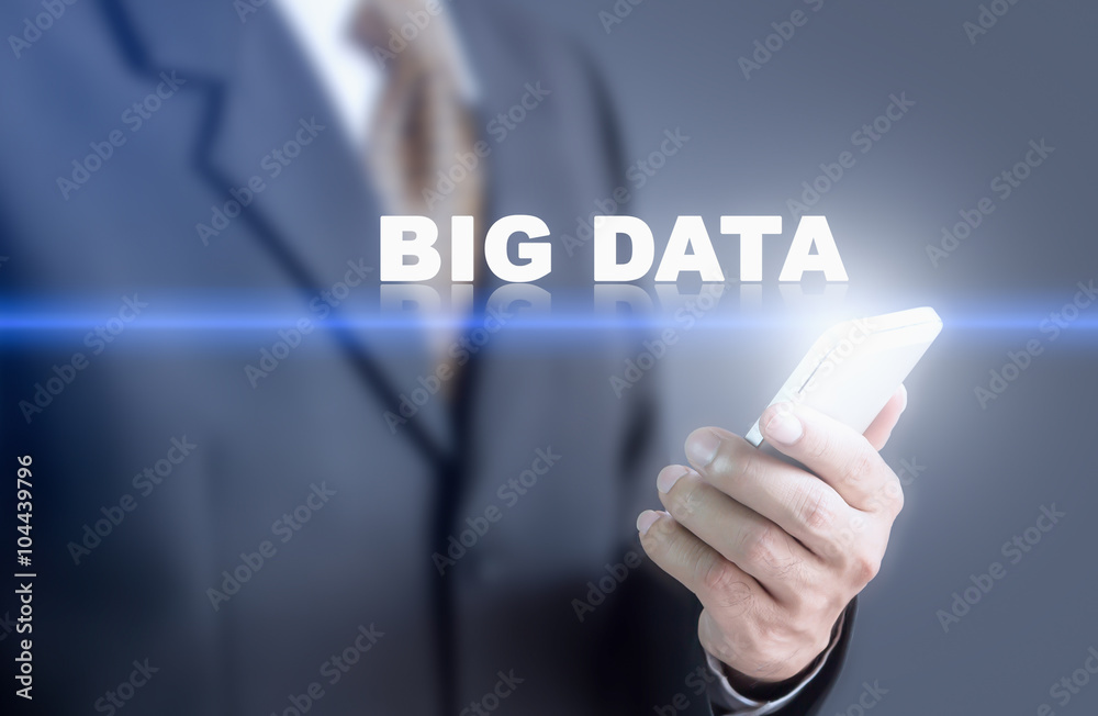 Businessman pressing hand BIG DATA message on virtual screen. Can bring to the medium of your ad.
