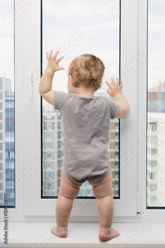 Child looking at window
