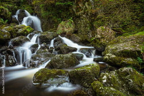 Beautiful trickling waterfall; Lodore Falls in Keswick, Lake District, UK. photo