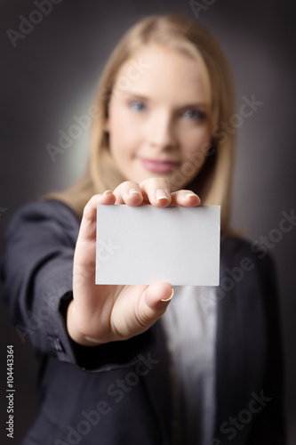 confident woman with business card