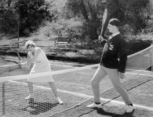 Fotografie Couple playing tennis together