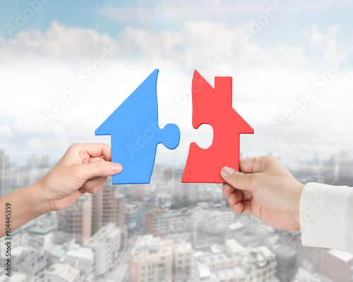 Woman man two hands assembling different colorful house shape pu