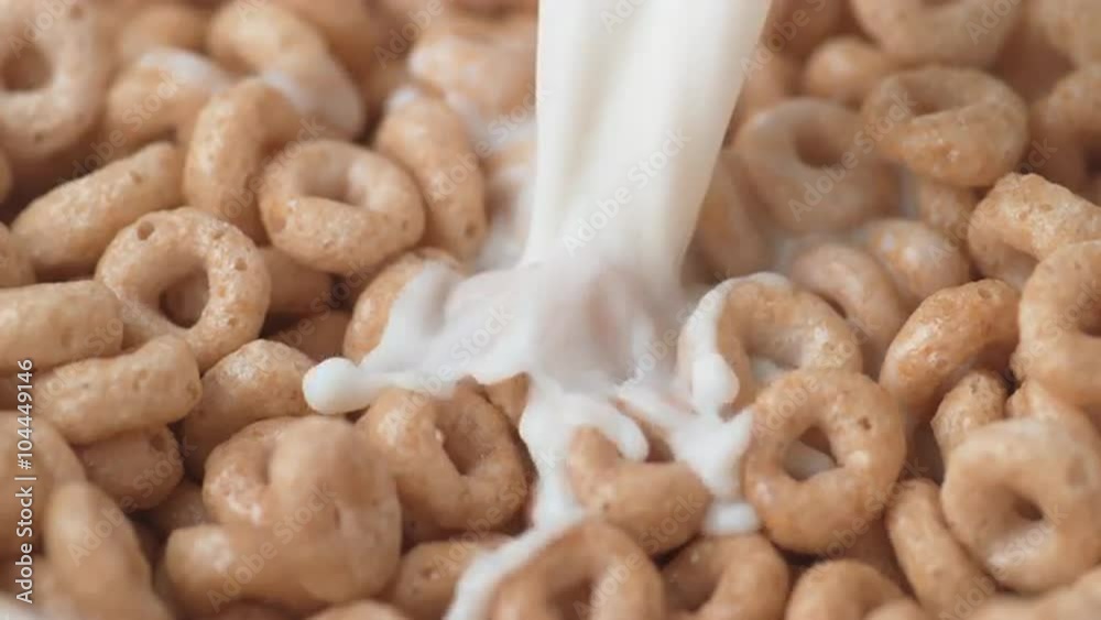 Pouing milk into cereal. Shot with high speed camera, phantom flex 4K. Slow Motion. Pouing milk into cereal. Shot with high speed camera, phantom flex 4K. Slow Motion.