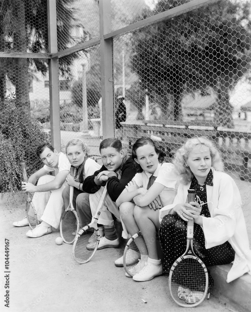 Row of tennis players with rackets Stock Photo | Adobe Stock