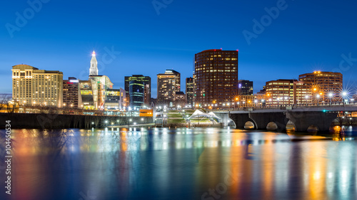 Hartford skyline and Founders Bridge at dusk. Hartford is the capital of Connecticut. © mandritoiu