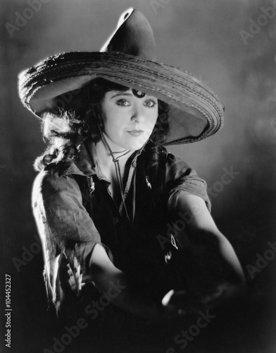 Portrait of a young woman wearing a Mexican hat 