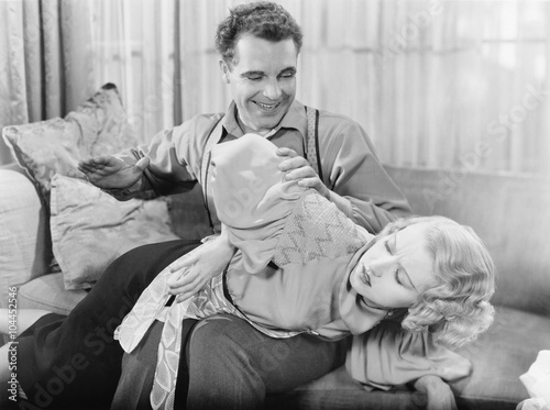 Man spanking a woman 
