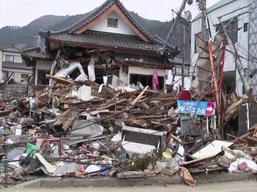 Search and rescue teams hunt for survivors following the devastating earthquake and tsunami in Japan in 2011.  photo