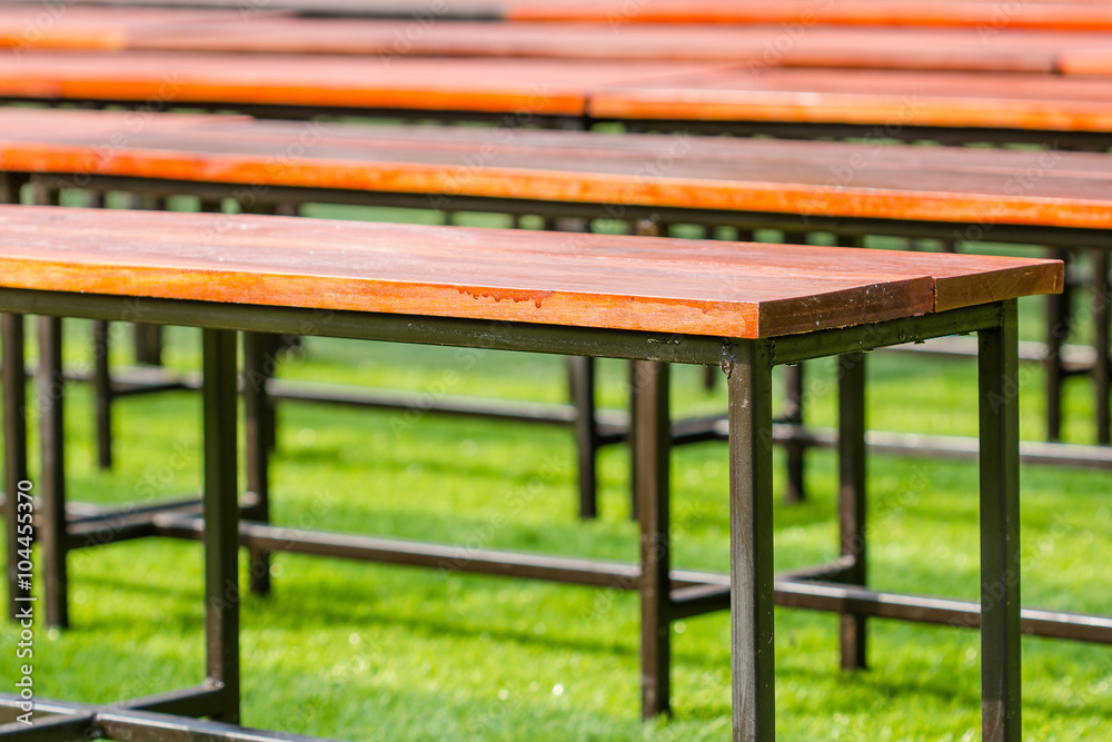 Fototapeta premium Bench in the park with green grass