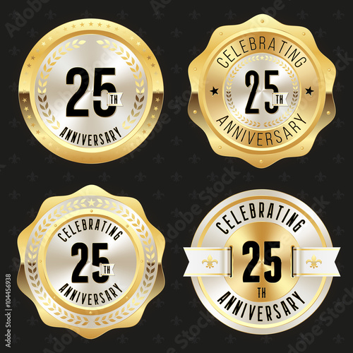 Collection of gold  25th anniversary badges on black background
