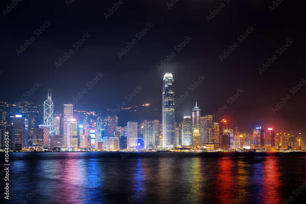 Night view of Hong Kong Island skyline across Victoria harbor