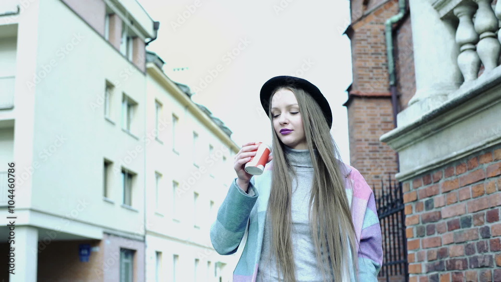 Pretty girl walking in the alley and drinking coffee
Pretty girl walking in the alley and drinking coffee
