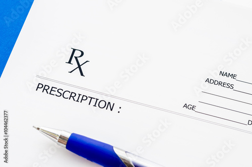 Medical prescription and pen.