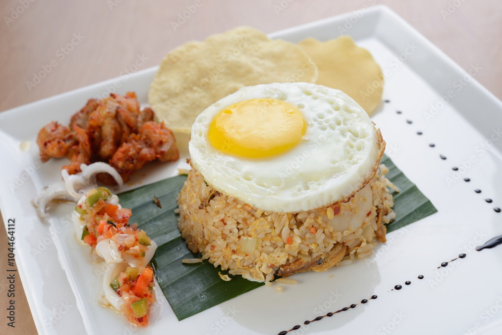 Fried rice with egg, chicken and prawn cracker Fried rice with egg, chicken and prawn cracker