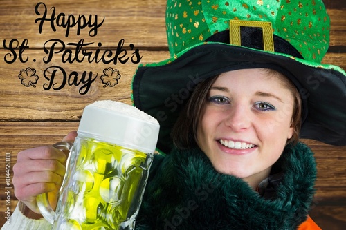 Woman holding beer next to st patricks day greeting photo