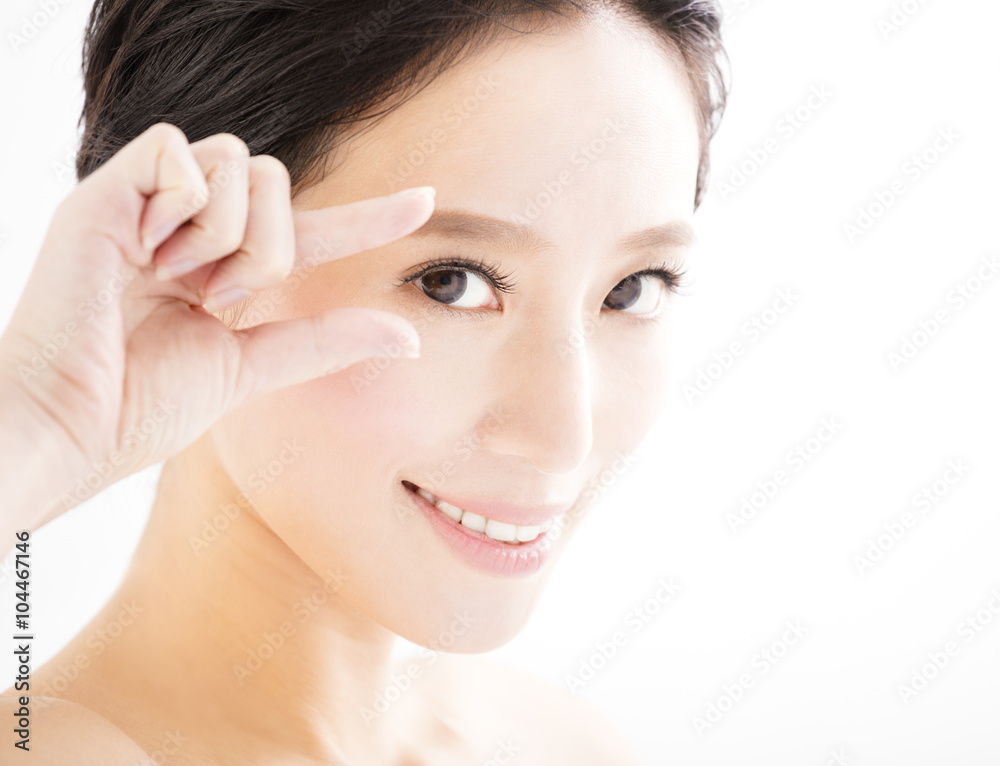 Closeup of young smiling woman eyes with gesture