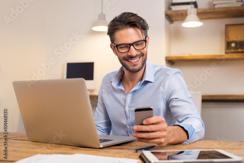 Happy man using smartphone