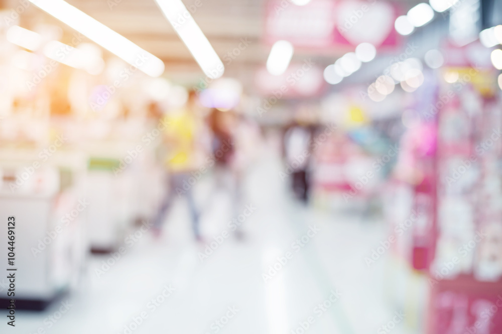 Abstract blurred interior of supermarket with people shopping background - vintage retro color filter