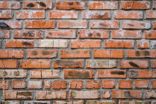 Vintage red brick wall background. Grunge brick weathered texture.