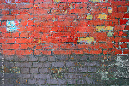Weathered texture of stained old dark brown and red brick wall , grungy blocks half painted © mettus
