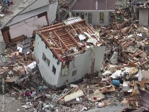 Search and rescue teams hunt for survivors following the devastating earthquake and tsunami in Japan in 2012 photo