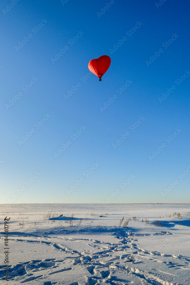 Fototapeta premium Balloon in the form of heart in the sky winter day
