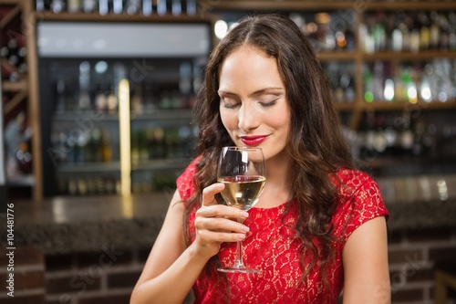 Pretty woman having a glass of wine