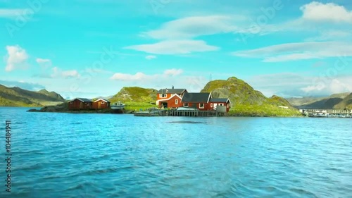 Flight over village at lake in lapland