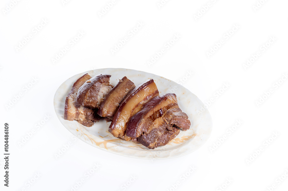 soy-stewed pork(chinese food) on a plate isolated on white background