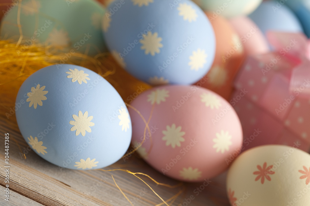 Colored Easter eggs in pastel colors and gift boxes